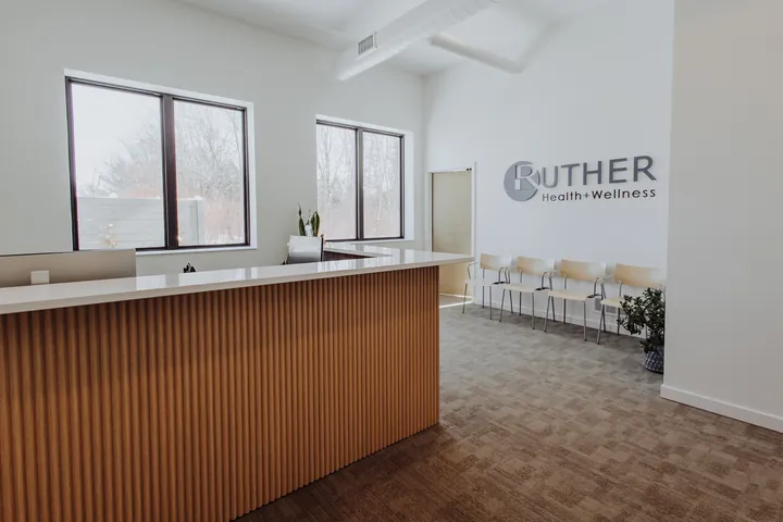 The front desk and waiting area at Ruther Health + Wellness