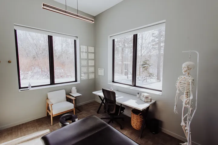 A private one-on-one treatment room with natural light